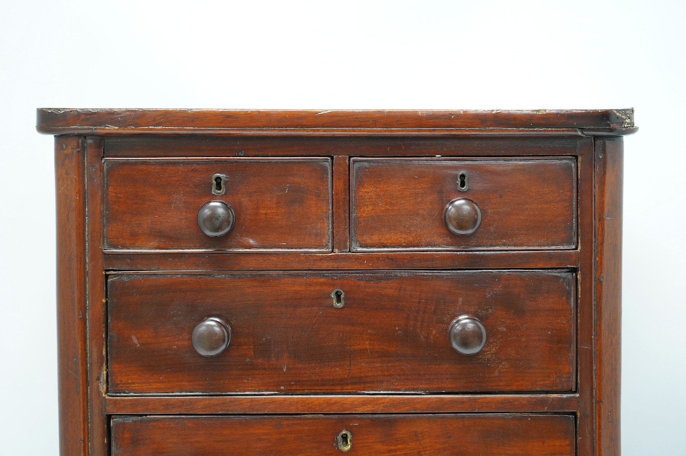 A Victorian mahogany miniature chest, on shaped plinth, 50cm wide, 49cm high. Condition - fair
